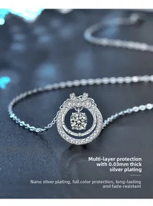 Macro shot of double-layered silver bow pendant with moissanite stones and polished finish