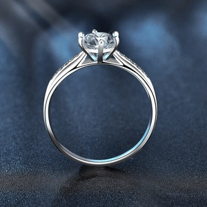 Classic 925 sterling silver ring with a large round moissanite and side stones
