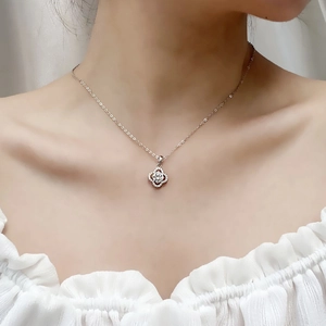 Elegant S925 sterling silver four-leaf clover moissanite pendant necklace on neck