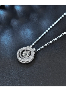 Macro detail of 925 silver double-layer necklace with bow pendant and Moissanite stone