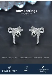 Detail of S925 silver bow stud earrings with Moissanite stone on dark blue background