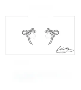 Original design sketch of bow stud earrings featuring pavé setting and main stone
