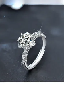 Macro detail of 925 sterling silver ring featuring a six-prong flower moissanite setting