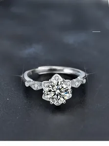 Close-up of 925 silver snowflake ring featuring a moissanite stone and 6-claw setting