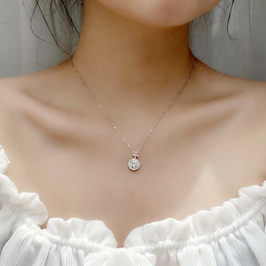 Sparkling Moissanite clover pendant necklace in 925 sterling silver worn by a model