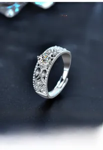 Macro shot of S925 silver ring with 6-prong moissanite setting and hollow patterns