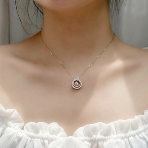 Double-layered 925 sterling silver necklace with bow pendant and dancing moissanite stone