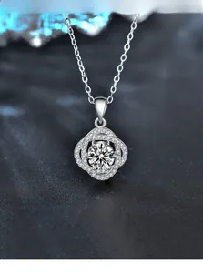 Macro shot of S925 sterling silver rose necklace with 3EX round moissanite pendant detail