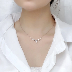 Elegant 925 sterling silver deer antler pendant necklace with moissanite on a model