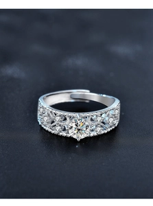 Macro shot of 925 silver open ring with vintage engraving and round moissanite