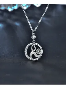 Macro shot of 925 sterling silver mermaid pendant with 3EX cut sparkling zircon stone