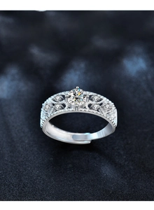 Macro detail of 925 silver adjustable ring with moissanite stone and hollow lace design