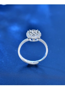 Macro shot of 1ct moissanite silver ring featuring halo setting and adjustable band