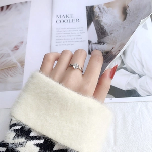 Close-up of 925 silver moissanite deer antler ring worn on hand with chic outfit