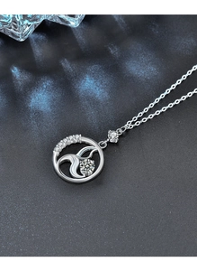 Close-up of S925 sterling silver mermaid tail necklace with sparkling pavé zircons
