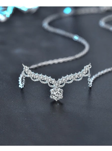 Detailed close-up of S925 sterling silver crown pendant with shimmering moissanite stones