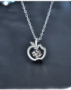 Macro shot of 925 silver apple pendant with 3EX cut moissanite and 58 facets