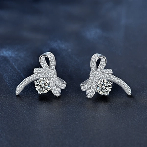 Elegant 925 silver bow stud earrings with sparkling round cubic zirconia stones