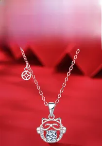 Detail of 925 sterling silver cat pendant with moissanite center and coin charm