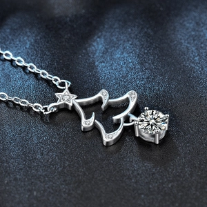 925 silver Christmas tree necklace with sparkling moissanite pendant on starry background