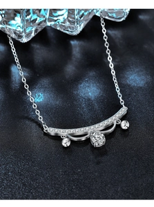 Macro shot of S925 sterling silver lace necklace with a sparkling moissanite bell pendant