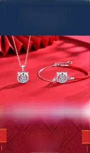 Tiger pendant necklace in 925 sterling silver with sparkling stones on red cord