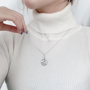 925 silver mermaid bubble necklace with swan pendant on white turtleneck sweater