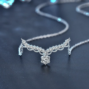 925 silver deer antler necklace with crown moissanite pendant on blue background