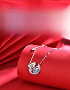 Detail of 925 silver dolphin pendant with 58-facet moissanite showing premium cut