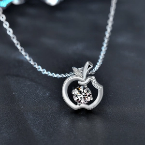 Elegant 925 sterling silver apple pendant necklace featuring a brilliant moissanite stone
