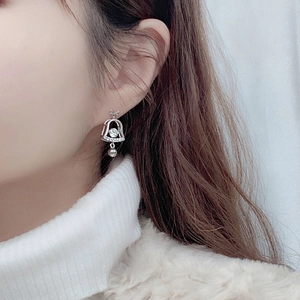 925 silver Christmas bell stud earrings with bow design and sparkling moissanite stones