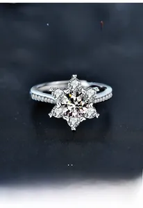 Close-up of S925 sterling silver snowflake ring featuring a moissanite center stone