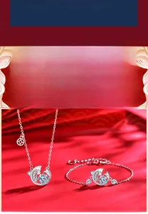 Detail of 925 sterling silver koi fish necklace and bracelet set with round zirconia