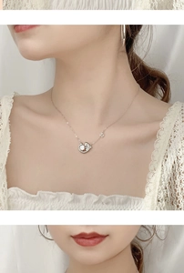 Macro detail of 925 sterling silver koi necklace with sparkling moissanite stone pendant