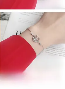 Macro detail of silver cat ear ring bracelet featuring a sparkling moissanite stone