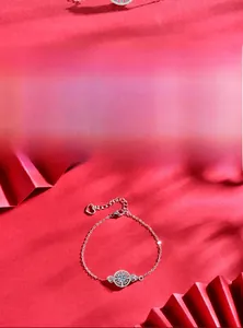 Macro detail of S925 silver bracelet featuring star pendant and brilliant cut moissanite