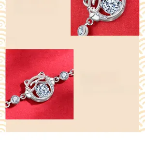 Detail of 925 sterling silver lucky cat bracelet featuring sparkling moissanite stones