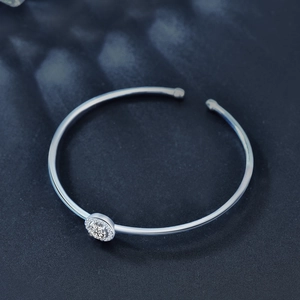 Minimalist 925 sterling silver open bangle with a halo moissanite circular charm