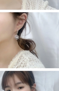 Détail de boucles d'oreilles monnaie en argent 925 avec moissanite et motifs creux
