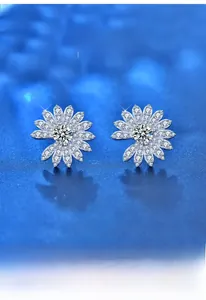 Macro shot of S925 silver daisy stud earrings with sparkling moissanite flower petals
