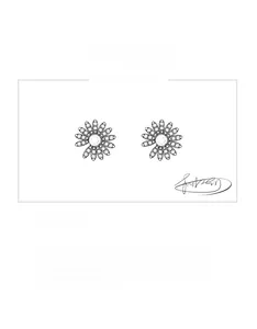 Detailed macro view of S925 sterling silver daisy stud earrings with sparkling crystals