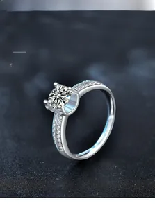 Macro view of 925 sterling silver moissanite ring with six-prong setting and side diamonds