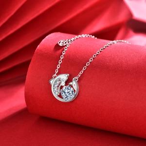 925 silver dolphin pendant necklace with round moissanite on red decorative display