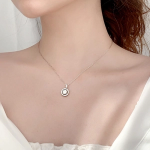 Moissanite round pendant necklace in rose gold on model neck minimalist 925 silver jewelry