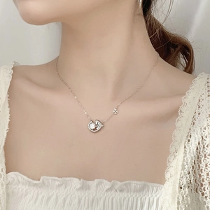 925 silver koi necklace with round moissanite pendant shown on female model