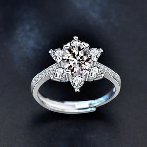 Adjustable 925 sterling silver snowflake ring featuring a moissanite center stone