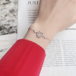 925 silver lucky cat bracelet with moissanite center stone on a female wrist