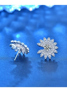 Macro shot of S925 sterling silver daisy earrings with sparkling moissanite petals