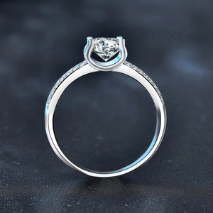 Moissanite 925 sterling silver ring with U-shaped pavé setting and central round diamond