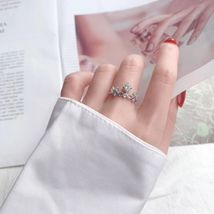 Elegant S925 sterling silver princess crown ring with sparkling moissanite on a finger